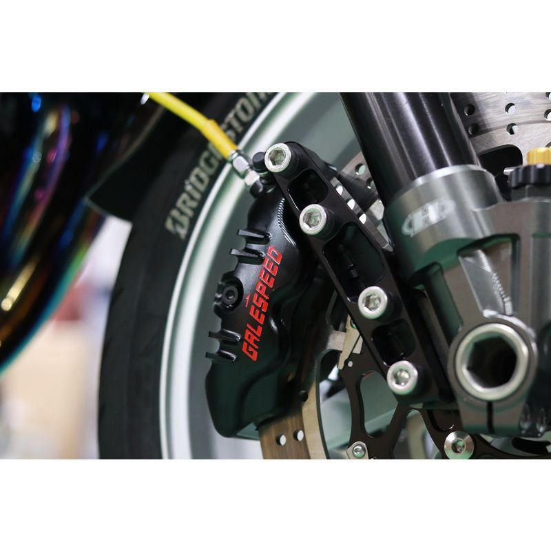 'Elaborate' Axial 4 Piston Front Caliper